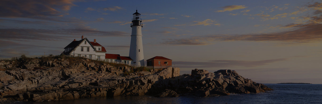 Market Street Settlement Group white lighthouse next to ocean